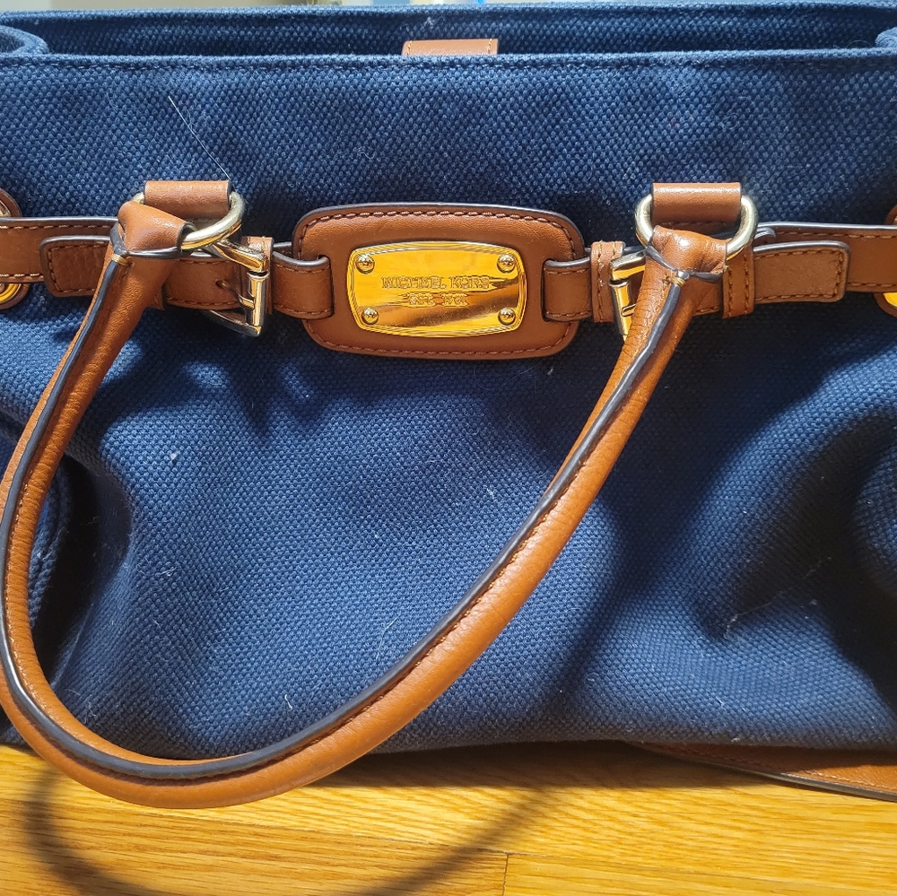 Michael Kors navy canvas material and brown purse